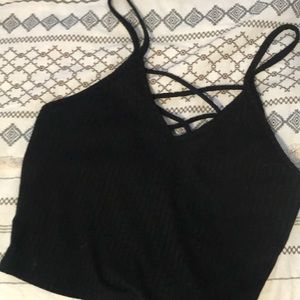 black cropped top with crossed string in back